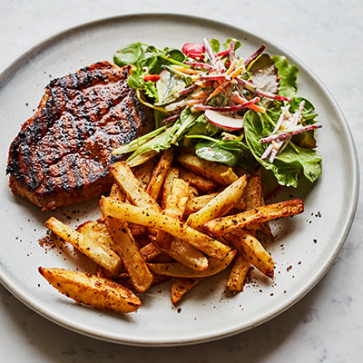 barbecued-pork-steaks-with-cajun-fries